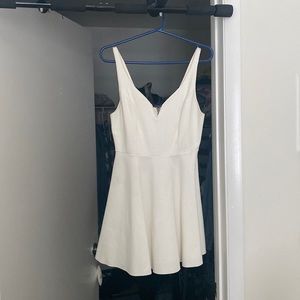 bought at Urban outfitters size medium white dress with heart detail on zipper